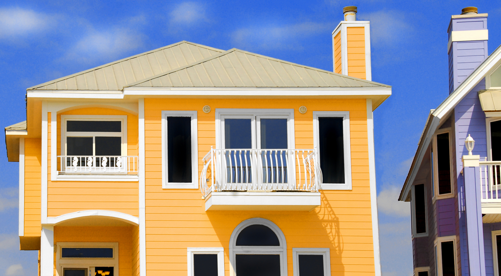 Bright yellow shore house rental with balcony, similar to properties where a slip and fall at a shore house rental could occur.  