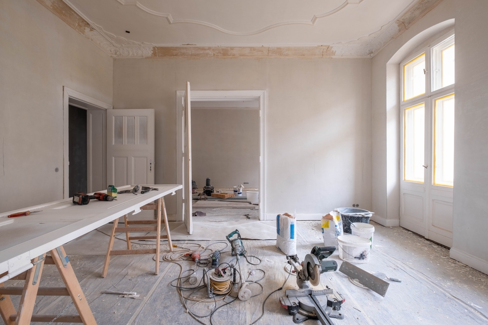 An unfinished room under renovation with tools and materials, illustrating the risks of renovation injuries and property owner liability.