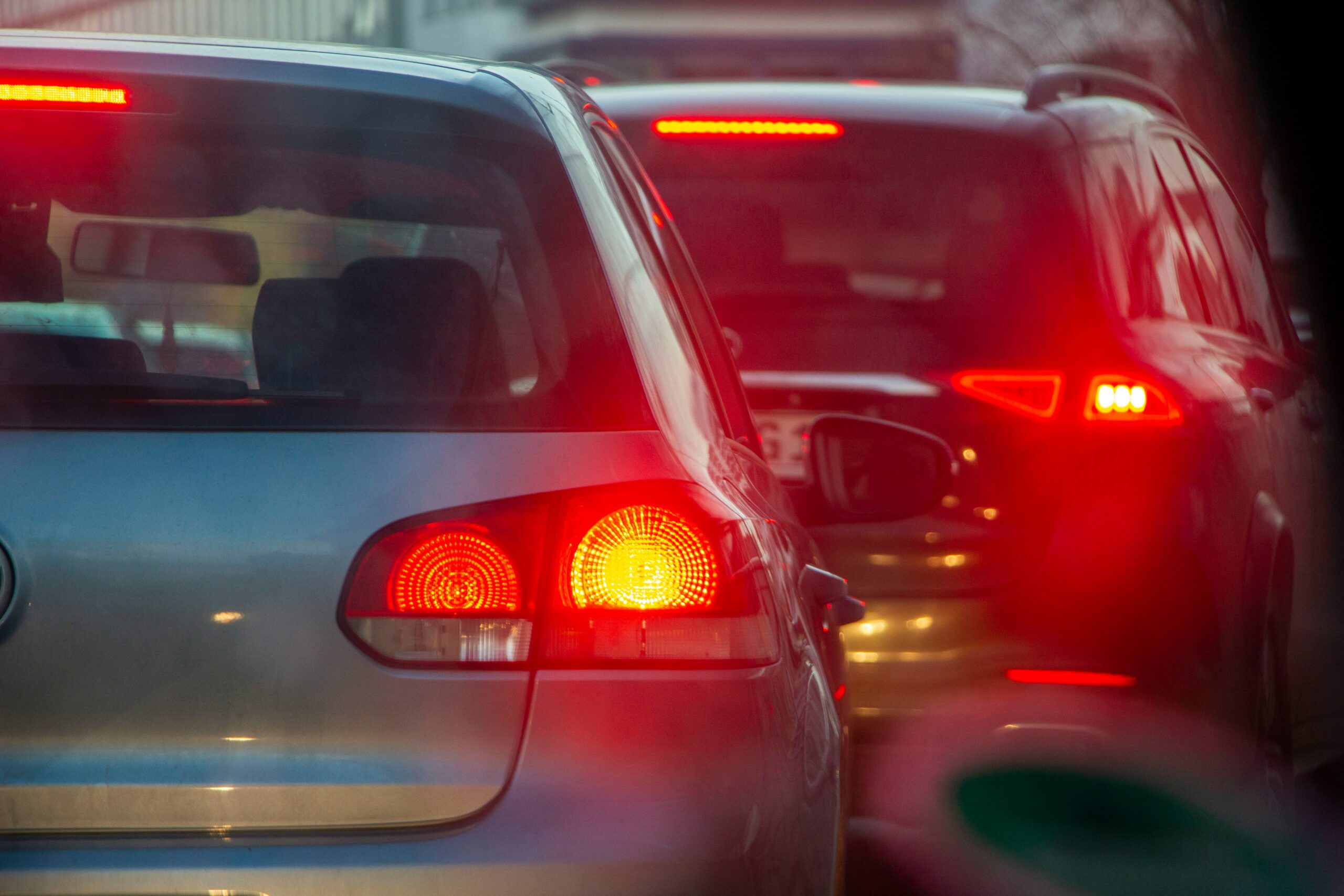 Cars stopped in heavy Easter weekend traffic with glowing brake lights during congested evening driving