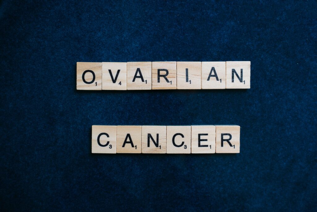 Scrabble tiles spelling ovarian cancer, representing ovarian cancer misdiagnosis after ignored symptoms and delayed diagnosis.