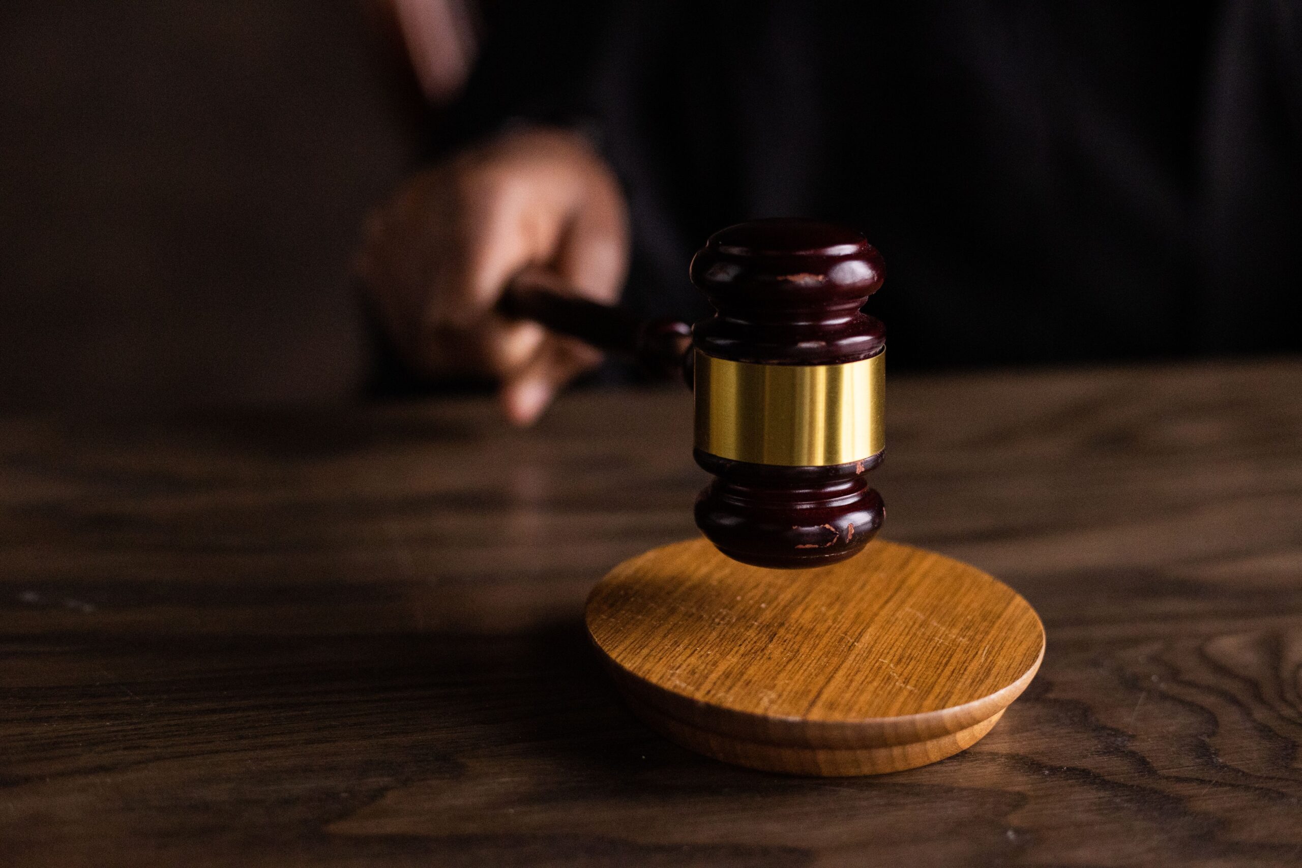 Judge striking a wooden gavel on a sound block, representing Uber sexual assault lawsuit verdicts